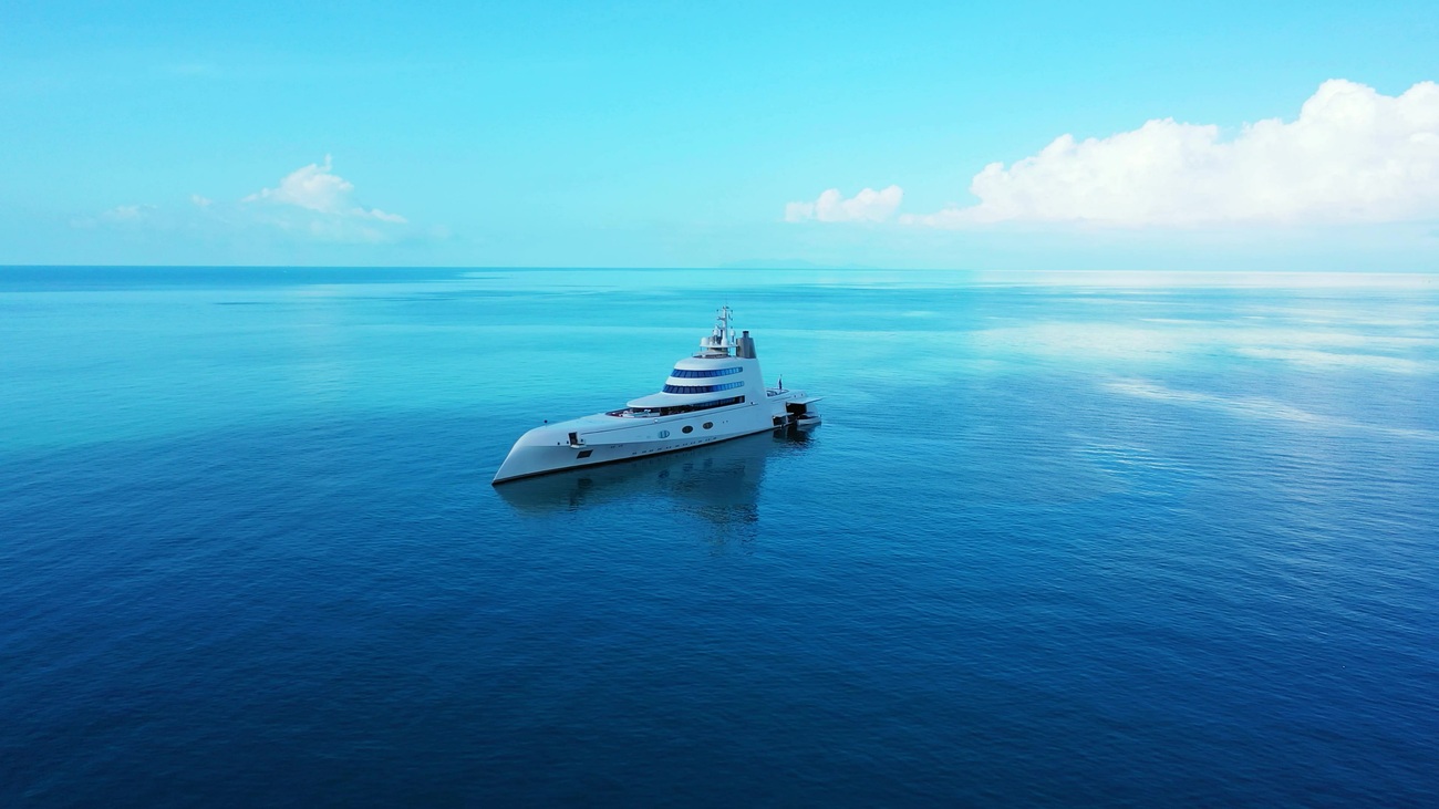 beautiful-shot-of-a-yacht-sailing-across-a-deep-bl-EQDD5Q6